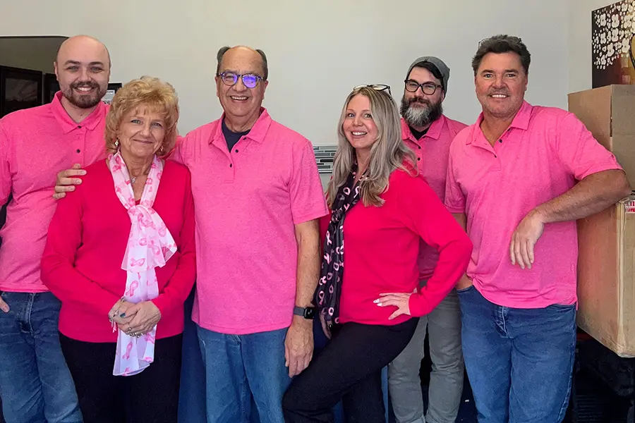 The netEffx team posing together, providing expert B2B IT support services with a focus on collaboration and innovation.