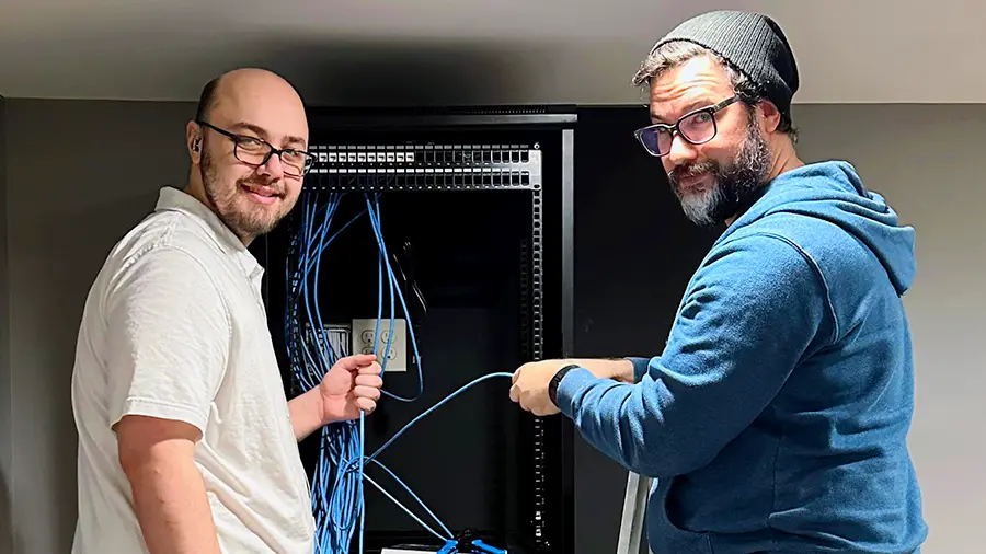 netEffx technicians installing structured wiring during a client’s office remodel—laying the foundation for reliable data, voice, and security systems.